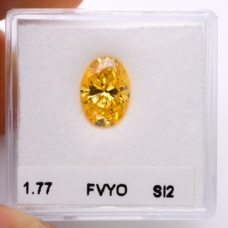 1.77 carat, Fancy Vivid Yellow Orange Diamond, Oval Shape, SI2 Clarity