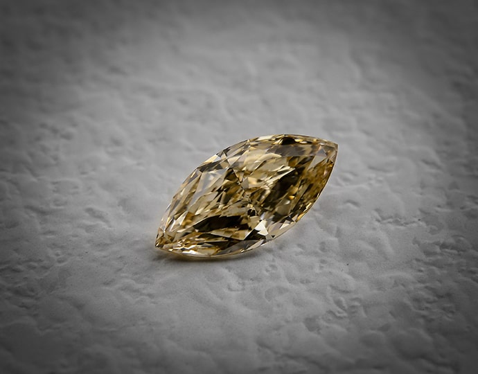 A 2.01 carat fancy brown yellow marquise shaped diamond